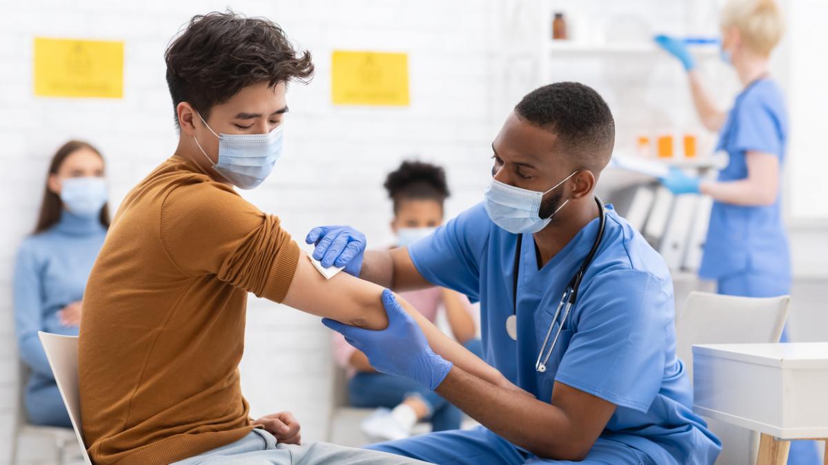 A healthcare professional administers a Covid jab