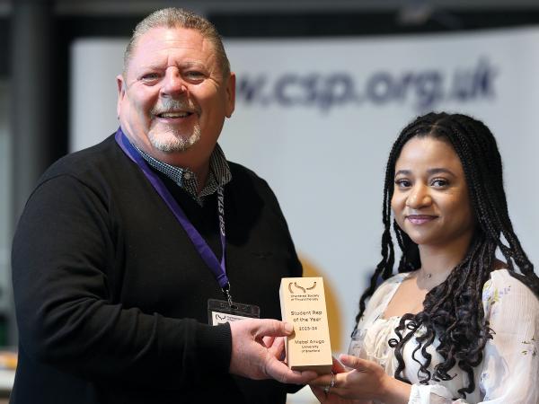 Frontline Nov 2024 CSP awards feature image of CSP CEO John Cowman and winner Mabel Anugo from the University of Bradford