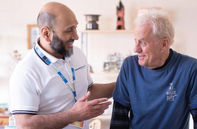 FLJul26Cover TransformingCare Senior physio Ali Shah with patient James Beaumont at a home visit [Photos: Nathan Clarke]