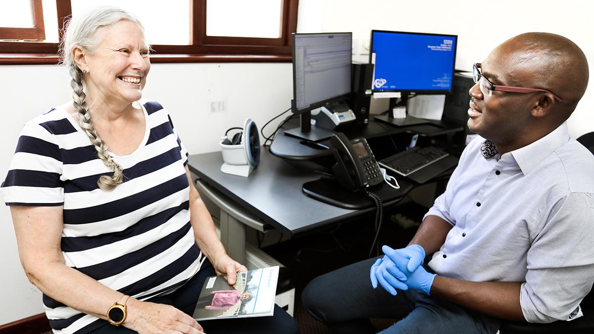 A first contact physiotherapist consults with a patient